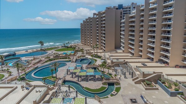 A resort with multiple swimming pools, a beach, and high-rise buildings. - Las Palomas Phase I Topaz 202 Exceptional OceanView 1BR 1BA Unit. (Puerto Peñasco)