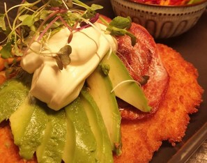 A dish called Elephant Schnitzel with avocado slices, sprouts, and a dollop of sauce. - Mount Elephant Hotel Motel (Derrinallum)