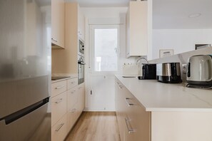 Fridge, microwave, oven, stovetop - Perfect Malasaña 1BR w/ Elevator, Washer & A/C, by Blueground (Madrid)