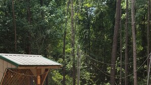 Property grounds - Cozy cabin in pleasant Brewton with AC, WiFi, and fire pit.  (Brewton)