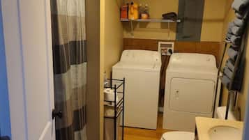 Shower, towels, soap, toilet paper
