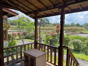 Cabaña Deluxe, balcón, vista al jardín | Vista al jardín