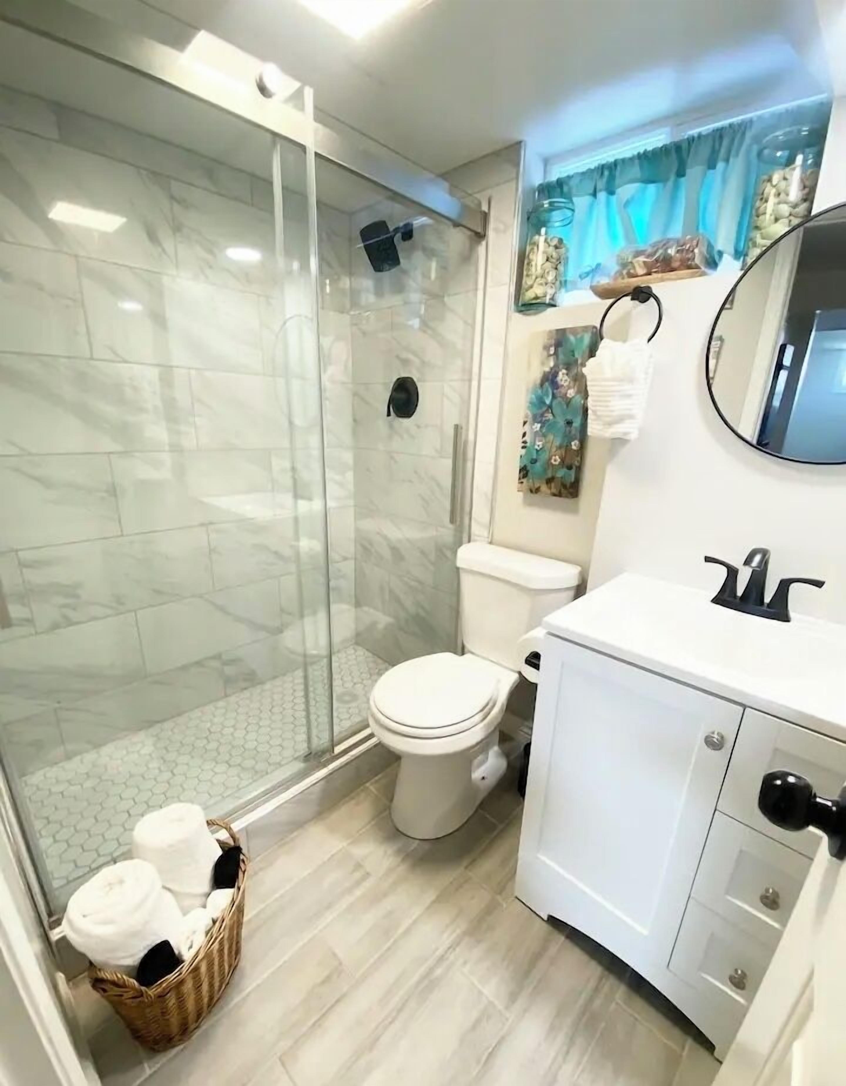 Shower, hair dryer, towels, soap