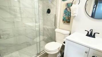 Shower, hair dryer, towels, soap