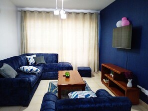 Business Apartment | Living area | 24-inch Smart TV with digital channels - Greatwall Gardens Athiriver (Athi River)