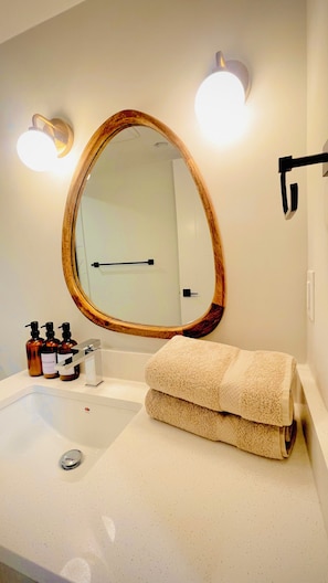 Shower, hair dryer, towels, soap
