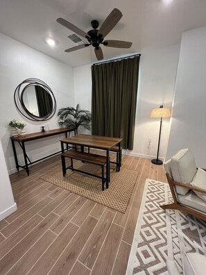 Enjoy a meal at the dining table with benches, or relax in the room's calm atmosphere.