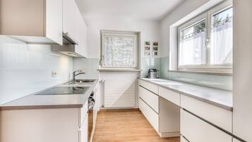 Fridge, stovetop, dishwasher, coffee/tea maker