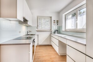 Fridge, stovetop, dishwasher, coffee/tea maker