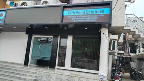 A building with a sign for Tech Point Solutions, featuring a contact number and email address. - WoodStock Homestay By GRB (Lucknow)