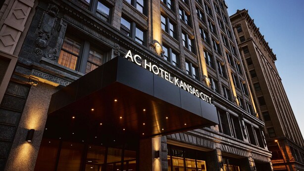The exterior of the ACHOTEL KANSAS CITY with a prominent entrance and classical architectural details. - AC Hotel by Marriott Kansas City Downtown (Kansas City)