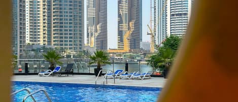 Outdoor pool, open 10:00 AM to 6:00 PM, pool umbrellas, sun loungers