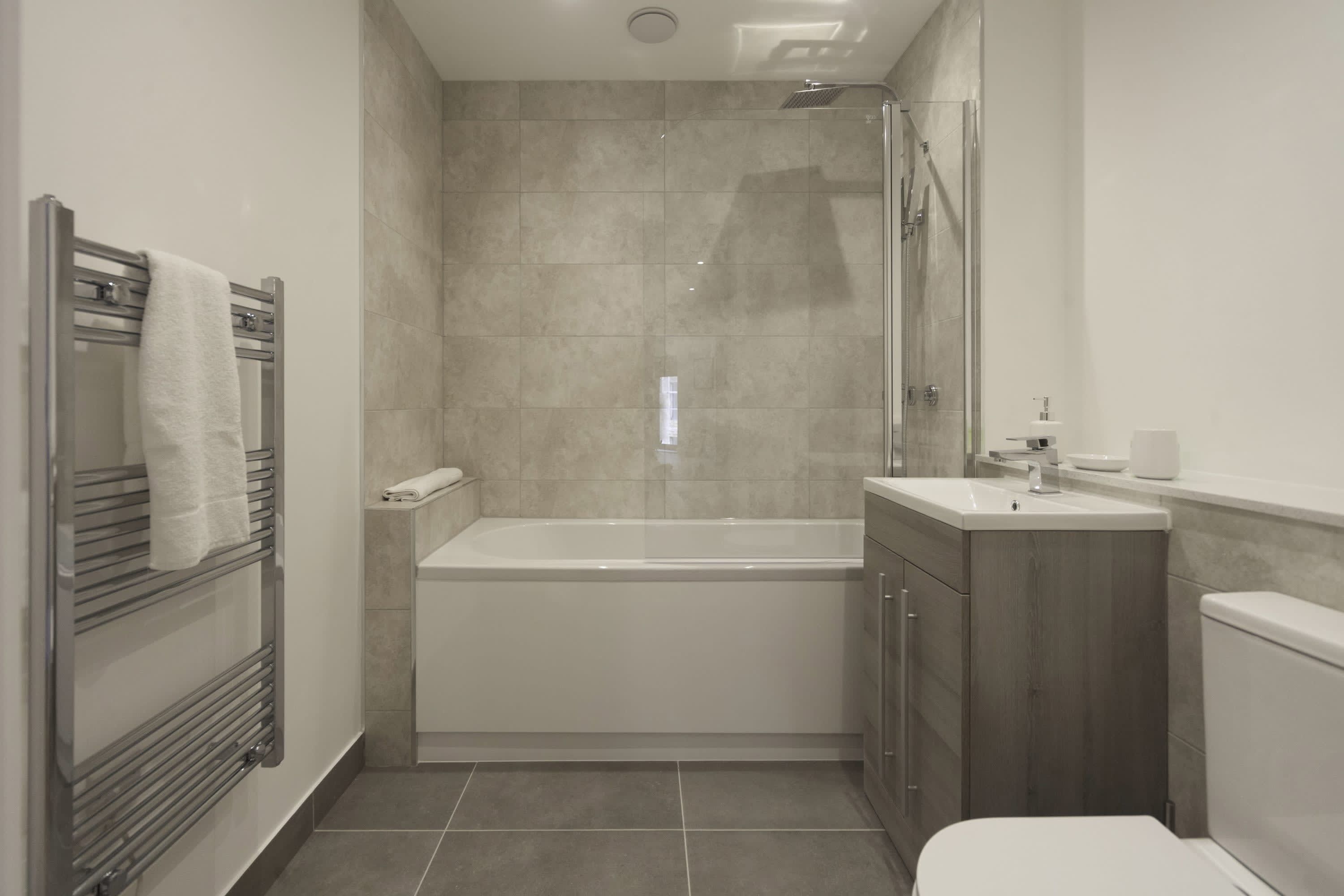 Shower, hair dryer, towels, shampoo
