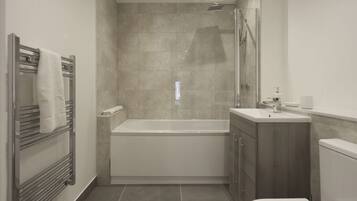 Shower, hair dryer, towels, shampoo