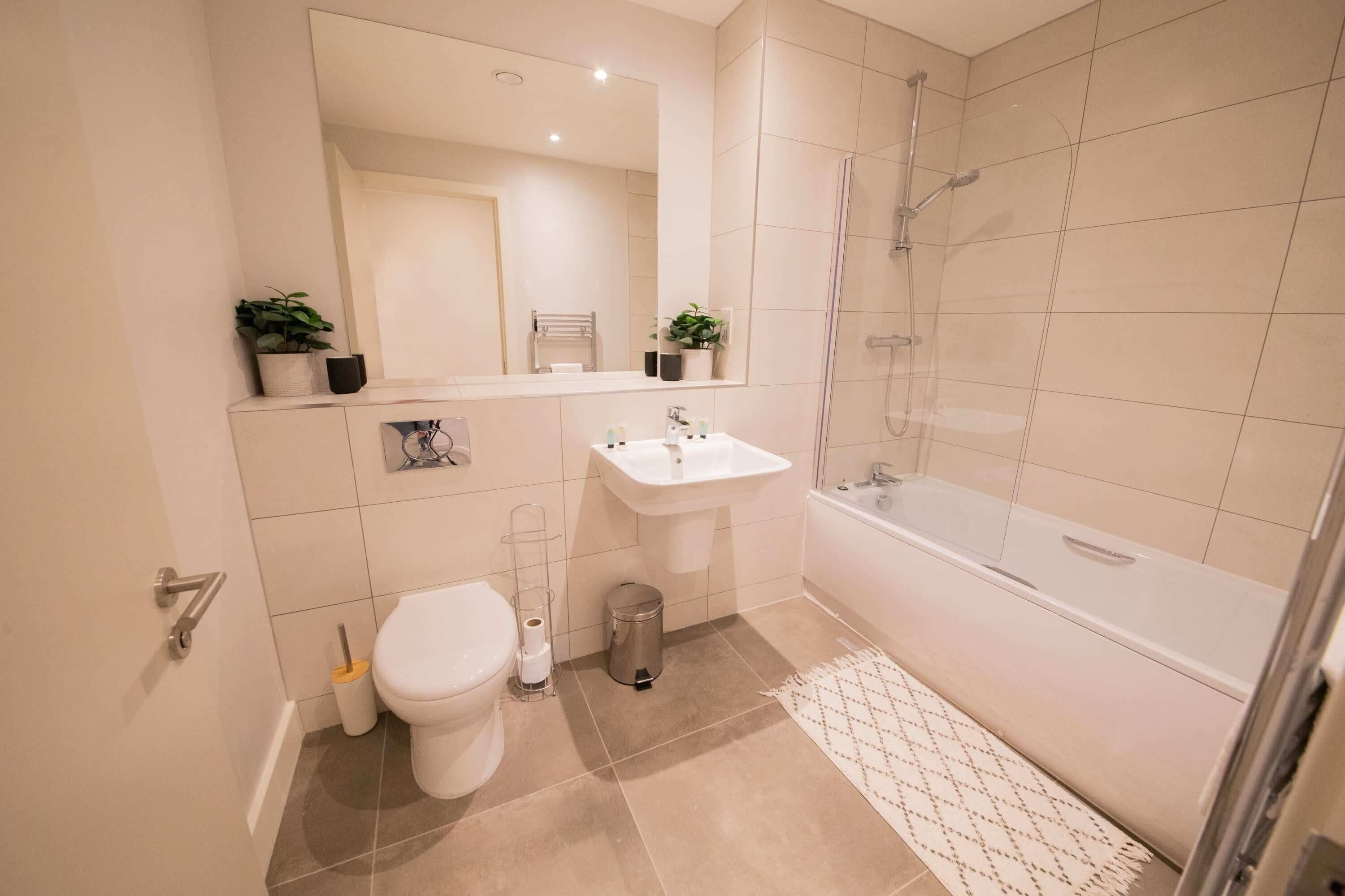 Shower, hair dryer, towels, shampoo