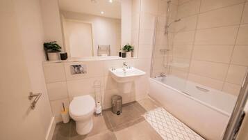 Shower, hair dryer, towels, shampoo