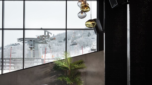 A modern indoor pool area with a clear view of the cityscape through large windows. - Riddergaarden Hotel & Mountain Lodge, Beitostølen (Øystre Slidre)
