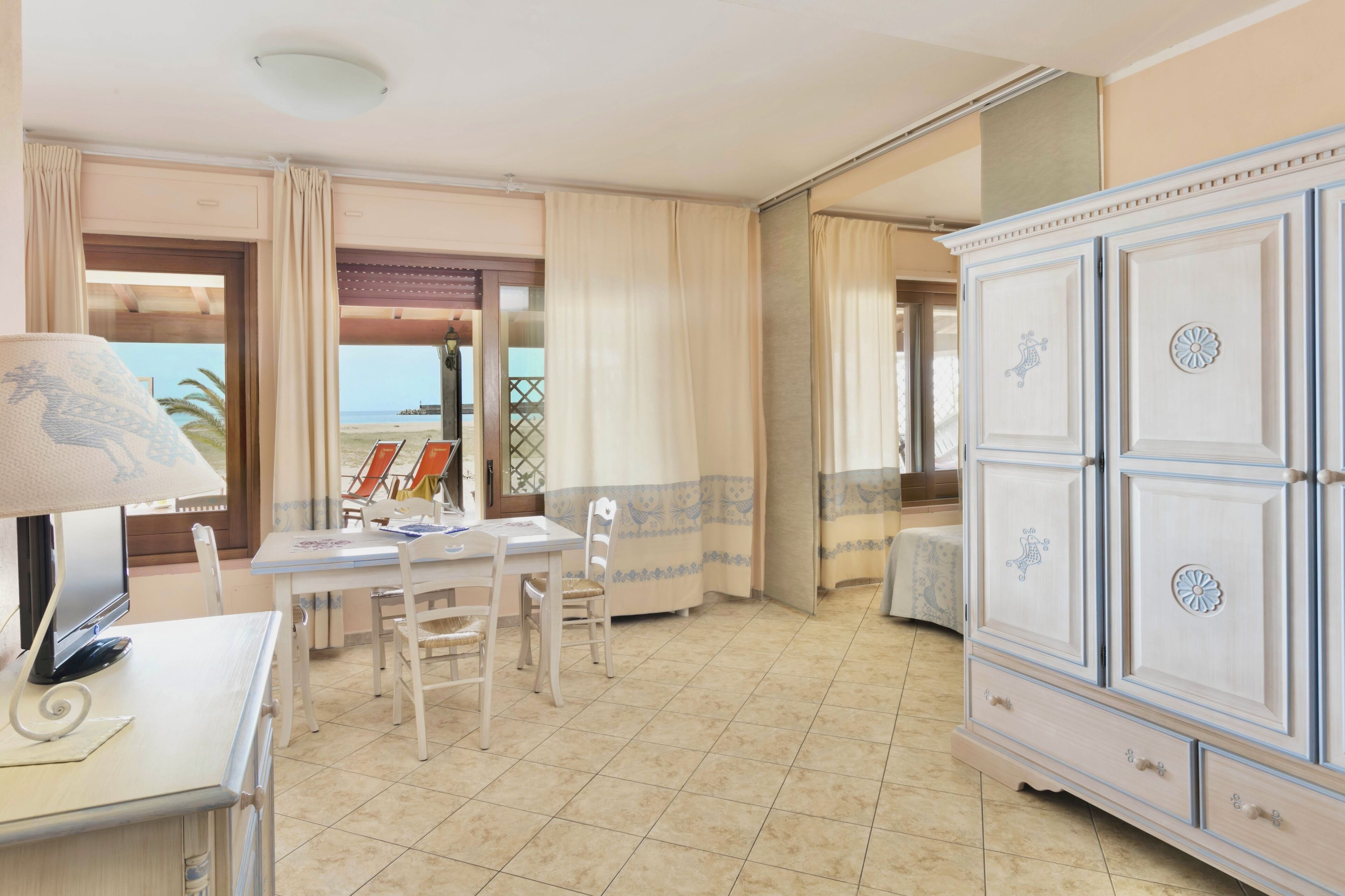 Studio, Sea View | Living area | 24-inch flat-screen TV with cable channels