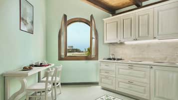 Junior Suite | Living area | 24-inch flat-screen TV with cable channels