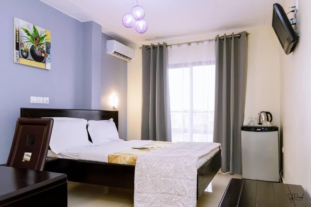 Room, City View | In-room safe, desk, blackout curtains, iron/ironing board