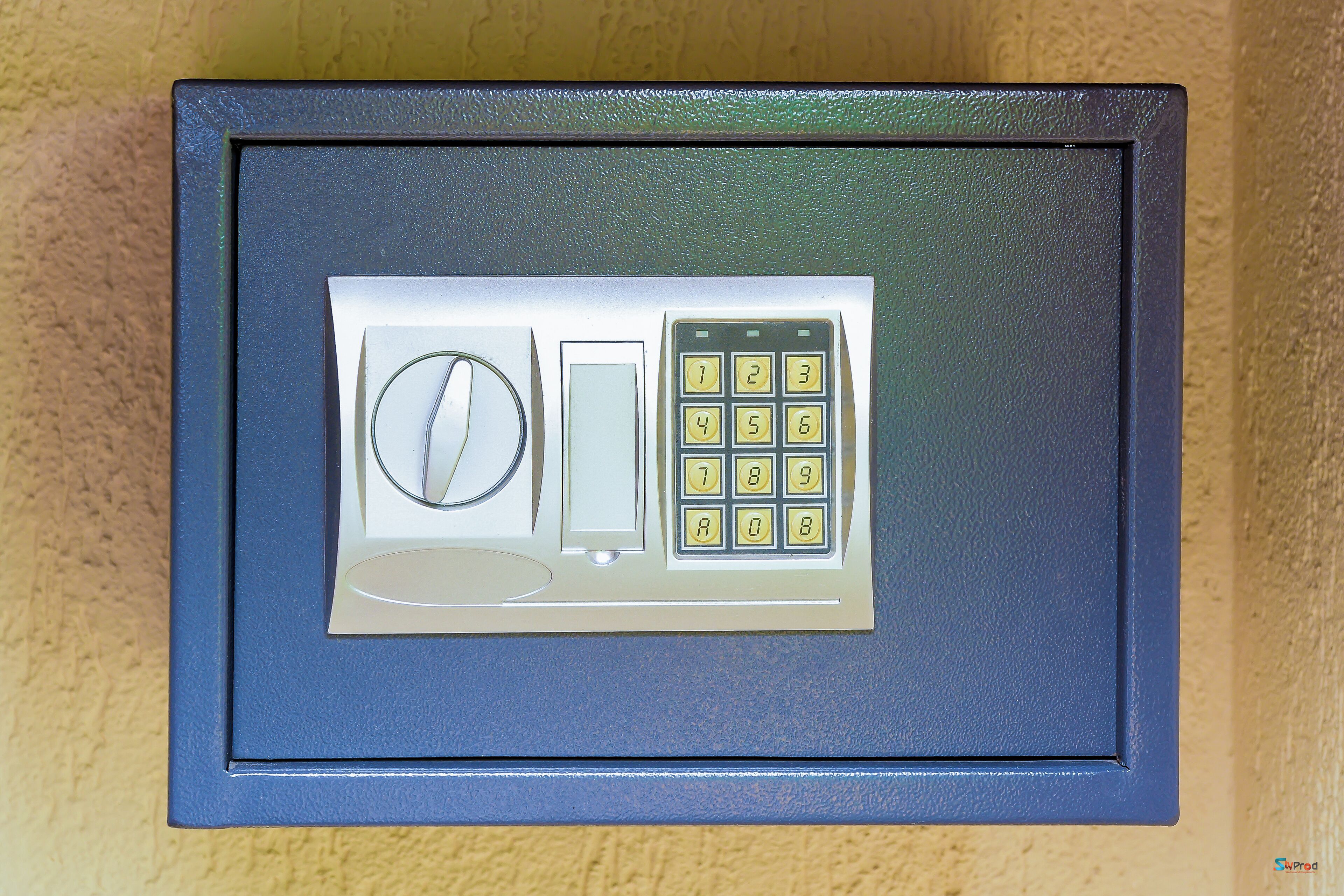 A safe with a keypad and a combination dial.