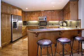Fridge, microwave, oven, stovetop - WestWall Ski In/Ski Out Lodge Luxury Mountain Accommodation A101 (Mt Crested Butte)