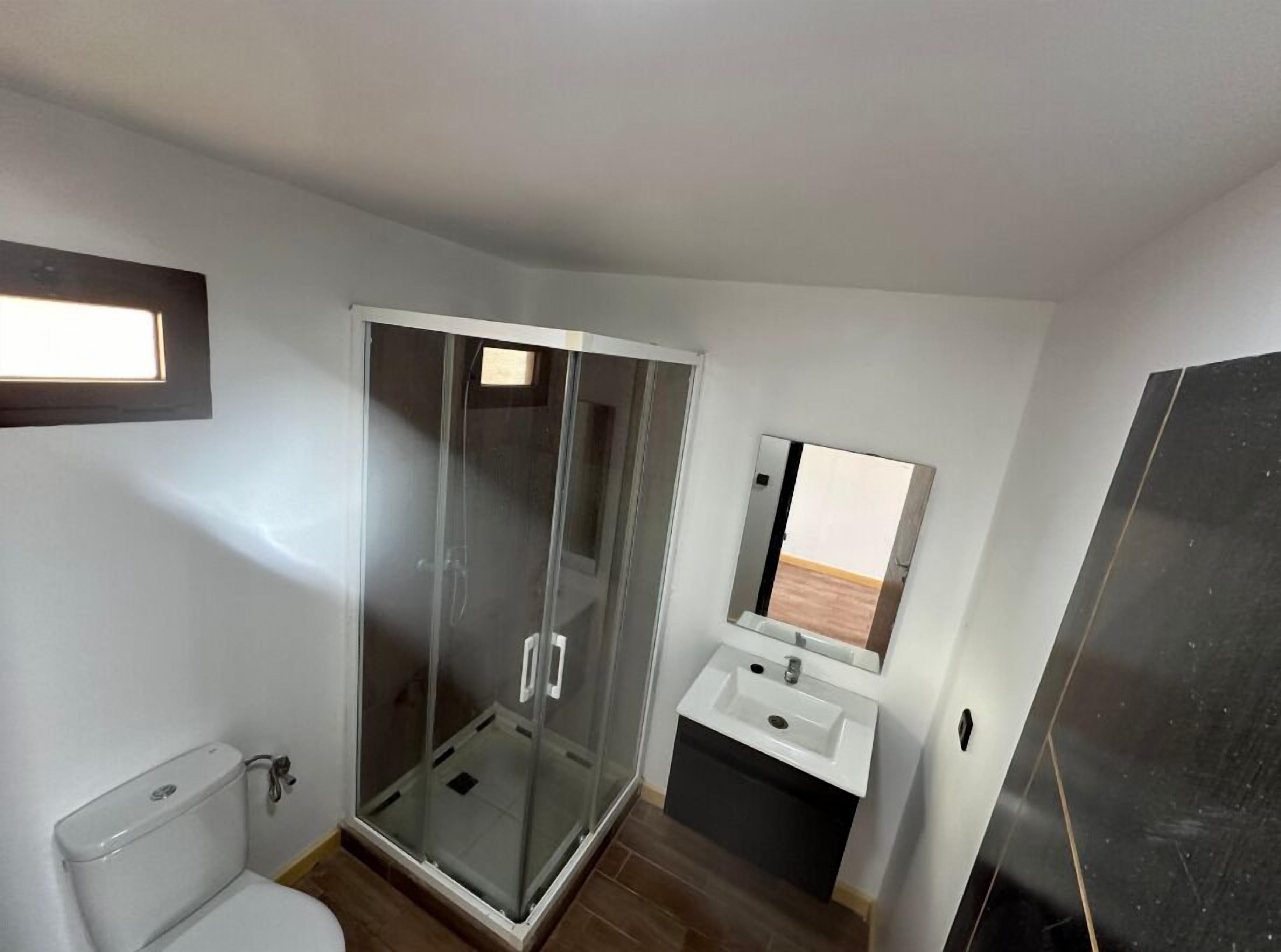 Shower, towels, toilet paper