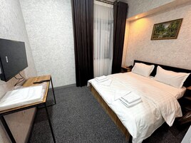 Ropa de cama de alta calidad y tabla de planchar con plancha 