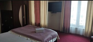 Chambre Triple Deluxe, vue ville | 1 chambre, fer et planche à repasser, Wi-Fi gratuit