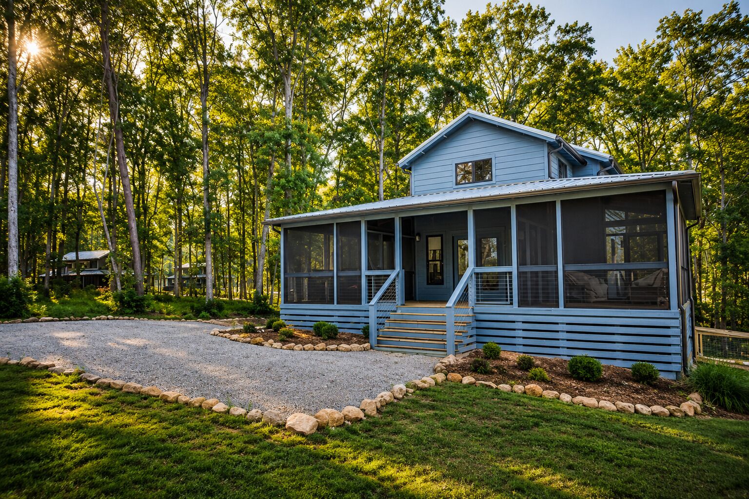 A two-story house with a porch, surrounded by a forest.