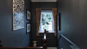 A staircase with a wooden handrail, a window with curtains, and a bird perched on the window sill. - Linden House/Slane/Near NewGrange (Slane)