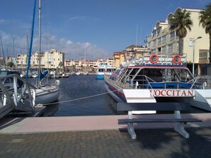 Guests can enjoy stunning views of the marina from the building's balconies.