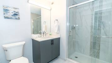 Shower, hair dryer, towels