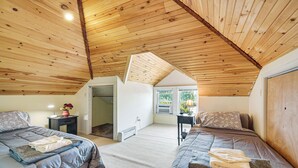 A bedroom with two beds, wooden ceiling beams, a window, and a door. - 15 Mi to Seven Springs Resort: Somerset Home! (Somerset)