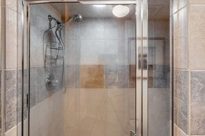 Shower, hair dryer, towels, shampoo