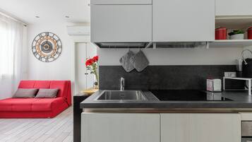 Apartment | Living area | 32-inch flat-screen TV with cable channels