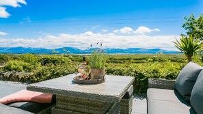 Terrace/patio - Maes y Ceirchdir - sleeps 10 guests  in 5 bedrooms (Newborough)