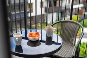 Enjoy a serene breakfast on the balcony with a view of the surrounding area.