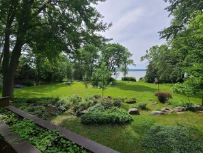 A well-maintained garden with a variety of plants and a seating area.