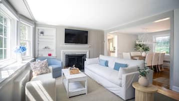 TV, fireplace, books
