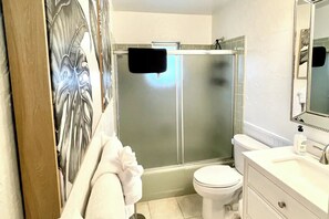 Shower, hair dryer, towels, soap