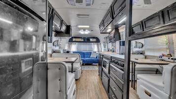 A look through the Airstream’s open layout from bath to lounge