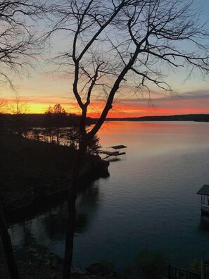 A lakeside view with a dock and a pier.
