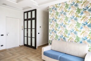 Apartment, Balcony | Living area | 35-inch TV with digital channels - La Casa di Partenope by Wonderful Italy (Naples)