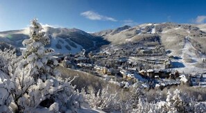 A snow-covered town with buildings and a mountain in the background. - 3 Bedroom - St James (Avon)