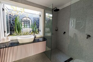 Shower, hair dryer, towels, soap