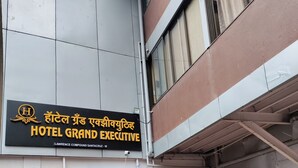 A sign for Hotel Grand Executive, indicating its name and location at Lawrence Compound, Santacruz West. - Hotel Grand Executive  (Mumbai)