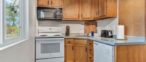 Fridge, microwave, stovetop, coffee/tea maker
