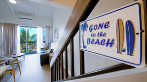 A hotel room with a view of the beach, a dining area, and a sign that says "Gone to the Beach". - Top Floor, 360 deg Ocean View, Totally Remodeled, 2-bed 2 bath with split AC (Kihei)