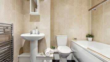 Shower, hair dryer, towels, shampoo